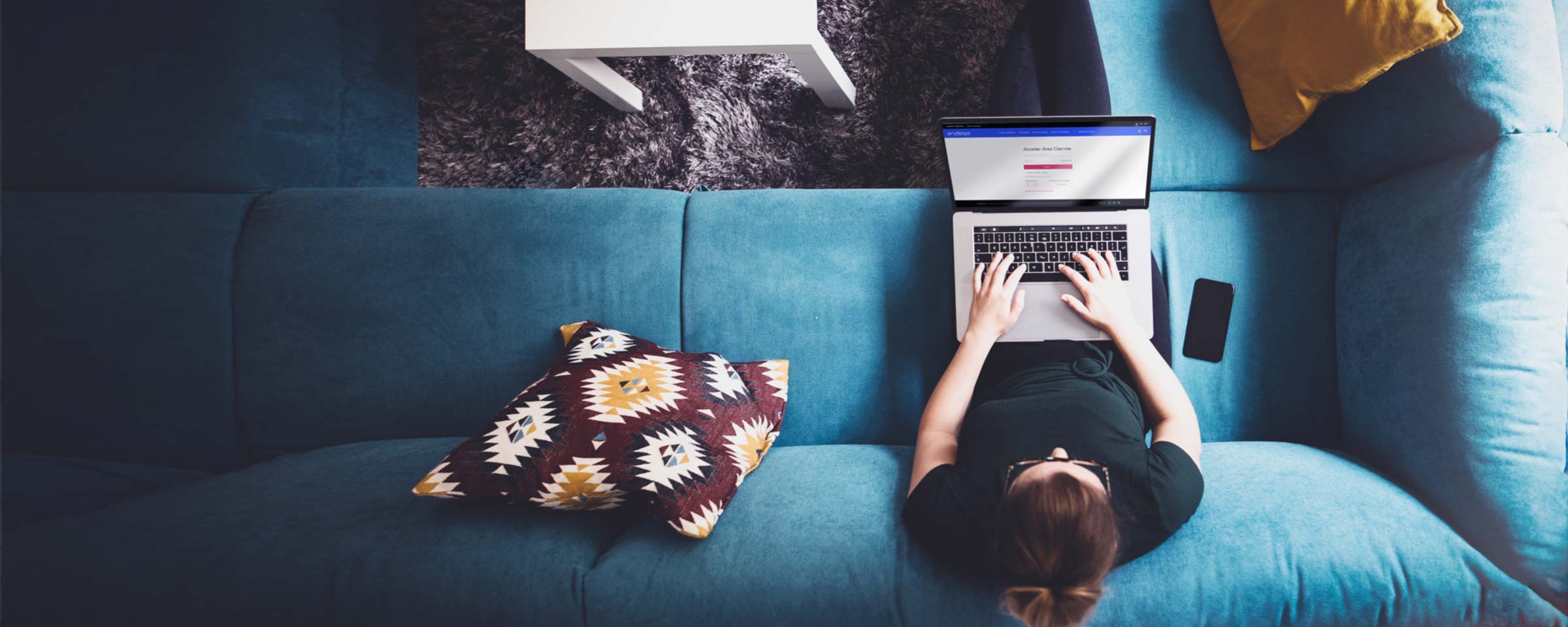  Side view portrait of a female businesswoman using laptop in a living room